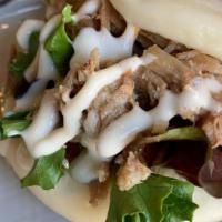 Pulled Pork Bun (2Pcs) · Steamed soft bread w/Pulled pork, mixed green, cucumber pickles & mayo, original sauce