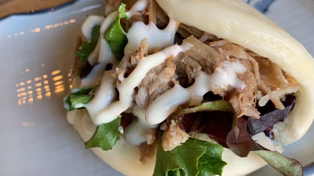 Pulled Pork Bun (2Pcs) · Steamed soft bread w/Pulled pork, mixed green, cucumber pickles & mayo, original sauce