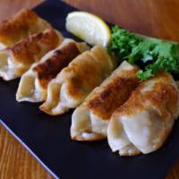 Yaki Gyoza · Pan fried pork with vegetable dumpling