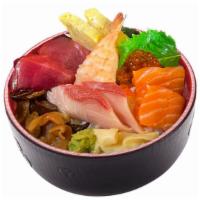 Chirashi · 15 pieces of chef's choice assorted sashimi over rice. Served with miso soup or  house salad.