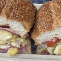 Classic Italian · Genoa salami,capicola, Italian ham, provolone,lettuce, tomato, oil and vinegar on a seeded h...