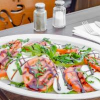 Caprese · Fresh mozzarella and sliced tomatoes with basil, olive oil, & balsamic.