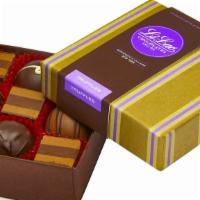 9 Pc. Truffle Box · Our finest ganache-filled truffles and hazelnut truffle squares are elegantly packed into th...