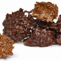 Coconut Clusters · We combine the highest-quality, soft and chewy toasted coconut shreds with our finest chocol...
