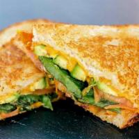 Grilled Cheese · A perfect grilled cheese with mozzarella and cheddar on sourdough bread with your toppings.
