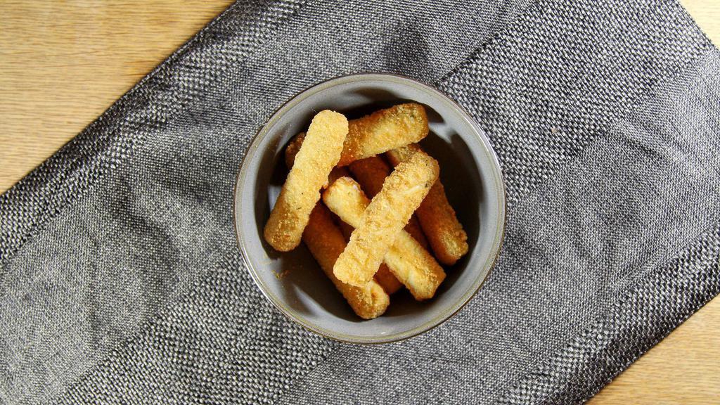 Mozzarella Sticks · Deep-fried cheese sticks. Crispy on the outside, gooey on the inside. Virtually guaranteed to be a table favorite! Served with a side of sauce.