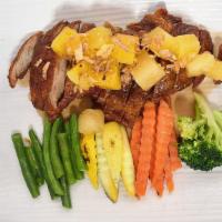 Tamarind Duck · Crispy roasted duck topped with pineapple and tamarind sauce.