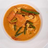 Panang Curry · Hot. Sautéed chicken, beef, pork or shrimp with pan roasted peanut, panang curry, kaffir lim...