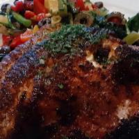 Blackened Red Snapper · Coated with Cajun spices served with a warm broccoli rabe salad with artichoke hearts, olive...