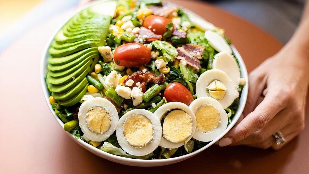 The Cobb Salad By @Spinach4Breakfast (New) · alfalfa mix [kale, romaine, butter lettuce], thick cut bacon, avocado, hard boiled egg, seasonal asparagus, corn, grape tomatoes, gorgonzola cheese, red wine poppy vinaigrette. A seasonal collaboration with @Spinach4Breakfast !