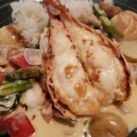 King Of The Sea · Lobster, scallop, shrimp with sautéed vegetables. Served with soup and rice.