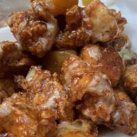 Pineapple Bbq Chicken Bites · Cubed fried chicken breast in a pineapple BBQ sauce.