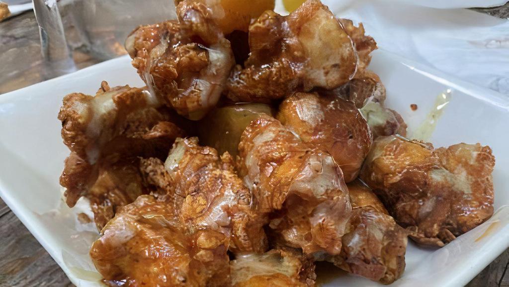 Pineapple Bbq Chicken Bites · Cubed fried chicken breast in a pineapple BBQ sauce.