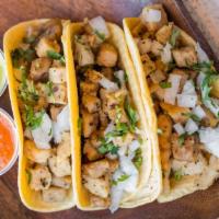 Tacos (3) · Choice of Soy Chicken, Soy Chorizo (GF) or Seitan, with white onions, cilantro and salsa ver...