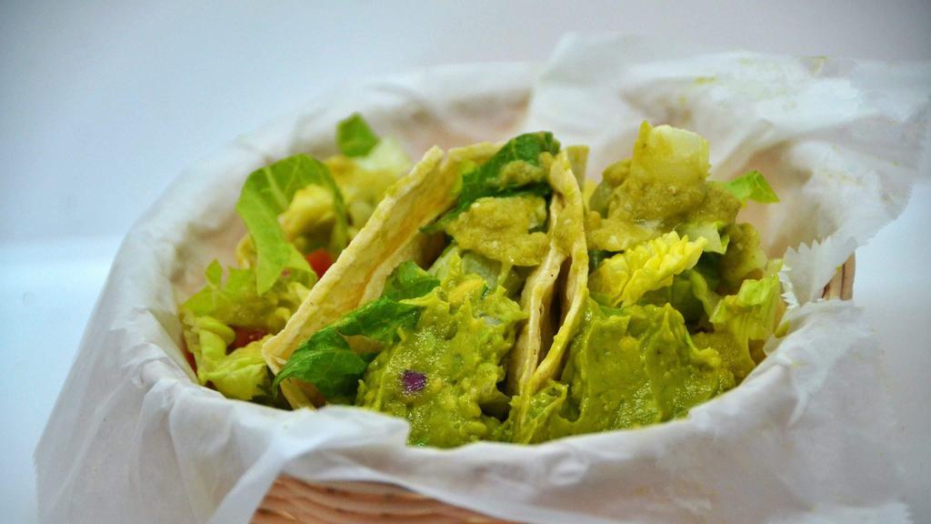 Guacamole Taco (4) · Guacamole, pico de gallo, lettuce and green sauce.
