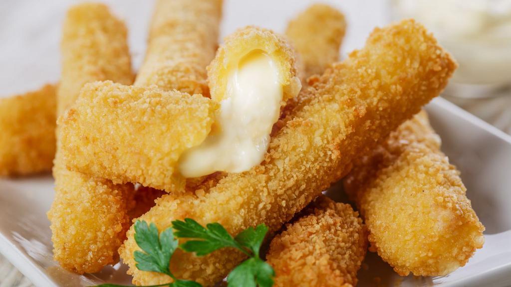 Mozzarella Sticks · Golden crispy sticks of creamy mozzarella cheese with a side of marinara dipping sauce.