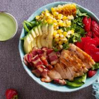 Grilled Chicken Cobb Salad · Hearty grilled chicken, crispy bacon, corn, and locally grown avocado, cucumber, and tomatoe...