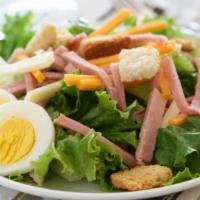 Chef Salad · Hearty roast beef, turkey, ham, Swiss cheese, hard-boiled eggs, and locally grown tomatoes a...