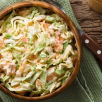 Coleslaw · Shredded locally grown cabbage and carrots tossed with mayo and mild seasoning.