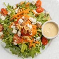 Walnut Gorgonzola Salad · With arugula, baby tomatoes, and carrots.