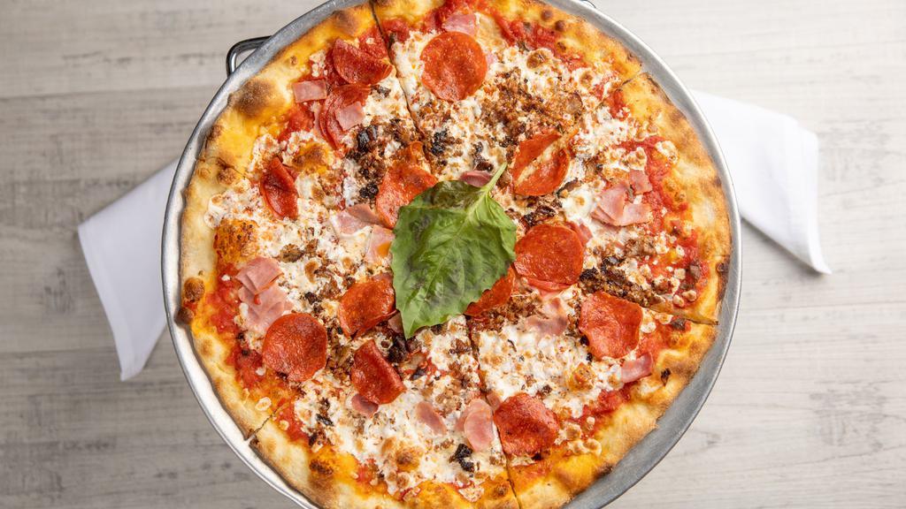 Pizza Magy · Pepperoni, ham, sausage, tomatoes, and mozzarella.