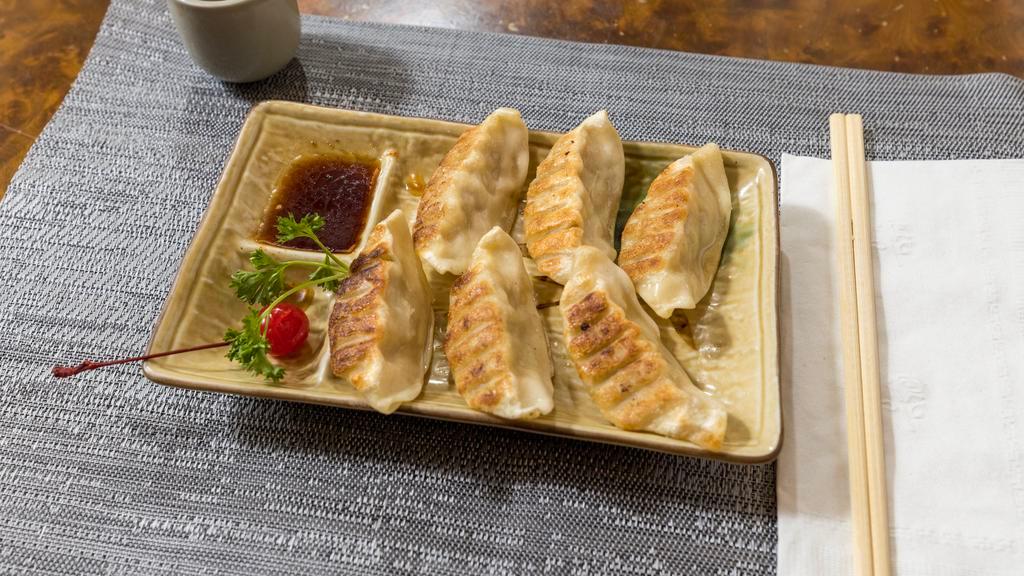 Gyoza · 6 pieces of pan-fried pork dumplings.