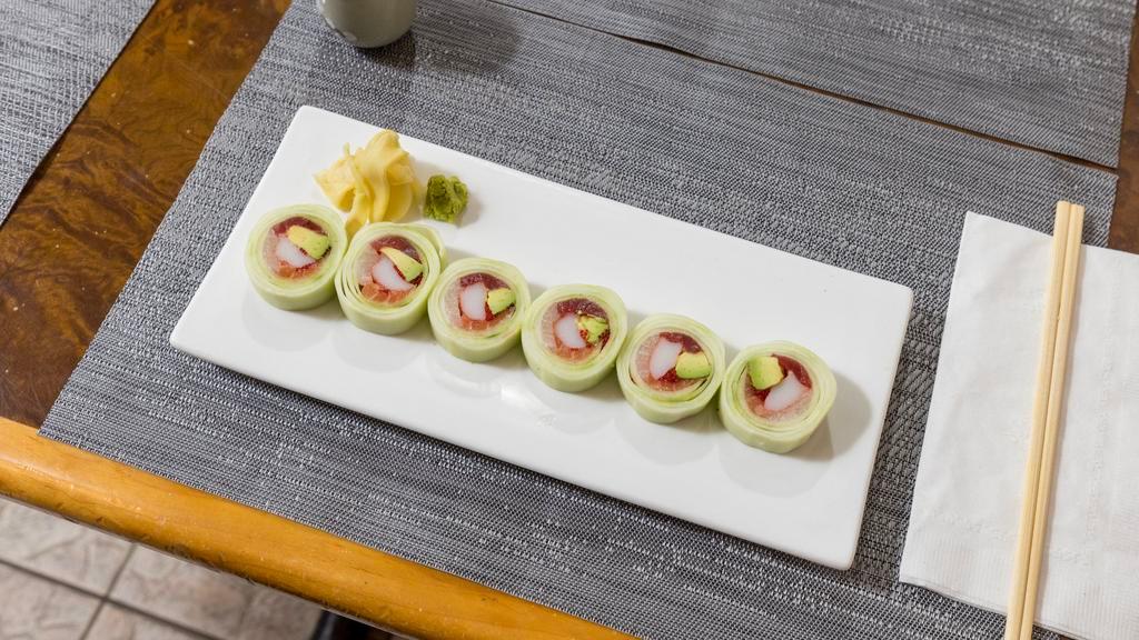 Rainbow Naruto Roll · Salmon, tuna, yellowtail, avocado, tobiko, kani rolled with thinly sliced cucumber.