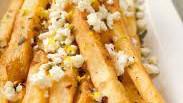 Feta Fries · Crispy french fries topped with feta cheese and parsley.