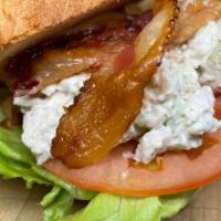 Egg Salad Sandwich · Freshly homemade egg salad topped with crispy lettuce ripe tomatoes on fresh wheat or rye br...