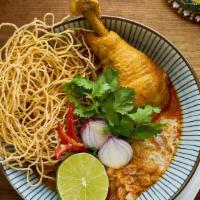 Khao Soi Kai (Chicken) · Northern Thai style steamed egg noodles with khao soi curry, braised chicken drumstick, red ...