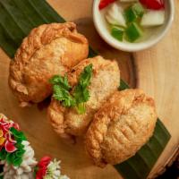 Thai Pastry Puff (3Pcs) · Thai style pastry's filled with grounded chicken, onions, potatoes and curry powder. Served ...