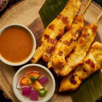 Chicken Satay · Gluten Free. Slowly grilled chicken breast on skewers marinated with coconut milk and curry ...