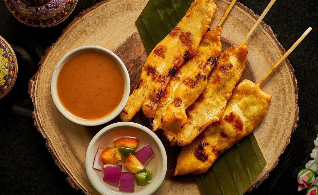 Chicken Satay · Gluten Free. Slowly grilled chicken breast on skewers marinated with coconut milk and curry powder. Served with a creamy Thai peanut sauce and sweet cucumber relish sauce.