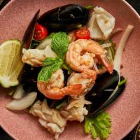 Yum Talay · Spicy Items, Gluten-Free. New Zealand green mussels, shrimp, squid, onions, Thai chili, lime...