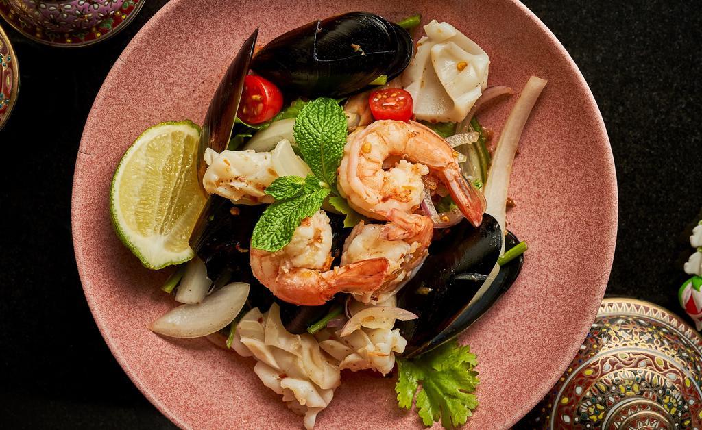 Yum Talay · Spicy Items, Gluten-Free. New Zealand green mussels, shrimp, squid, onions, Thai chili, lime and cilantro.