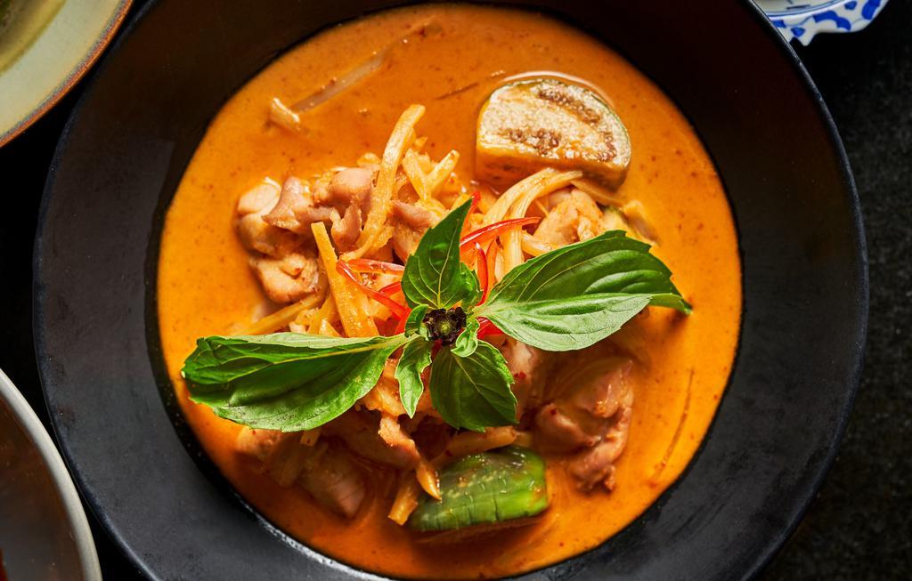 Red Curry · Gluten Free. Spicy Item. A popular Thai dish consisting of the spicy bold taste of dried red chili paste, coconut milk, Thai eggplant, bell pepper, bamboo shoots and fresh Thai basil leaves. Served with jasmine rice.