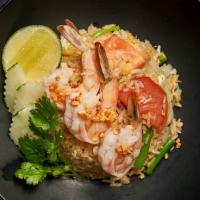 Thai Fried Rice · Thai style fried rice with egg, onions, scallions and tomatoes.