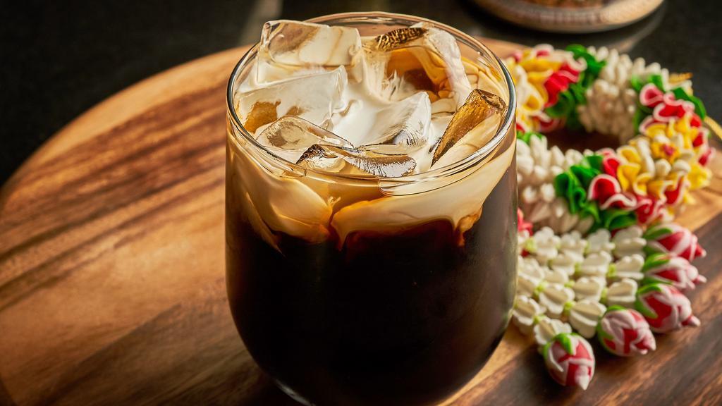 Thai Iced Coffee · Strongly-brewed black coffee sweetened with sugar and milk served over ice.