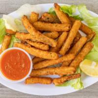 Zucchini Sticks · Coded and fresh zucchini breaded and fried served with sauce.