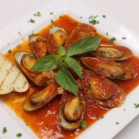 Mussels Marinara · Served over pasta. fresh mussels sauteed in a marinara. served with a house salad and bread.