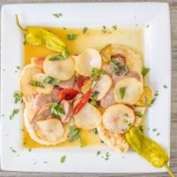 Chicken Scarpariello Dinner · Diced chicken breast sautéed with sausage, sweet and hot peppers and potatoes in a garlic wh...