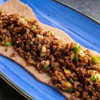 Ras Kitfo · Protein Pea crumble | Spice infused grape seed oil | Mitmita