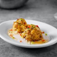 Sizzling Crab Cakes · Three jumbo lump crab cakes with sizzling lemon butter. 480 cal.