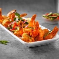Spicy Shrimp · Succulent jumbo shrimp, lightly fried, tossed in a spicy cream sauce, served with a tangy cu...
