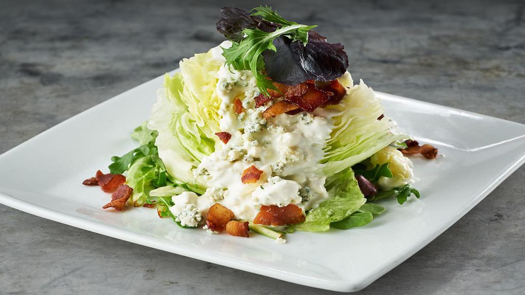 Lettuce Wedge · Crisp iceberg, field greens, bacon, bleu cheese and choice of dressing
