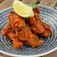 A-7 Tom Yum Wings · Deep fried breaded chicken wings coated with sweet and spicy Tom Yum flavored sauce served w...