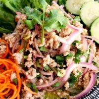 Sa-2 Larb · Choice of Ground Chicken, Ground Beef or Tofu tossed in spicy lime dressing with scallion, r...
