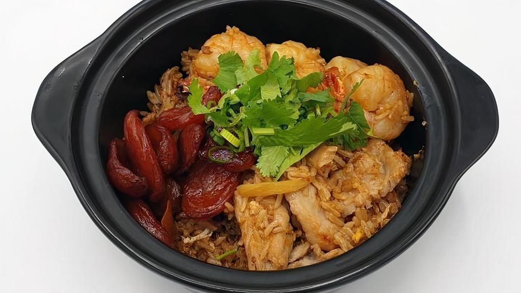 M-3 Clay Pot Rice · Rice cooked in sweet soy sauce with sweet Thai sausage, pork, shrimp, ginger, mushroom, egg, scallion, and cilantro **If you need plastic utensils, please request.**