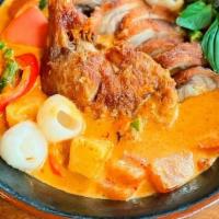 M-11 Lychee Duck Curry · Half crispy roasted duck with lychee, pineapple,  tomato, string bean, bell pepper, and basi...