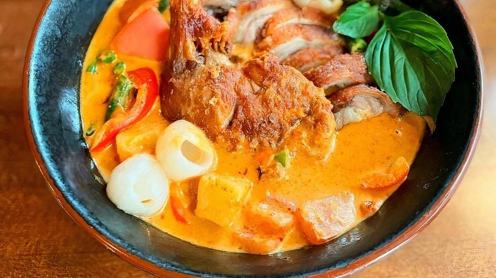 M-11 Lychee Duck Curry · Half crispy roasted duck with lychee, pineapple,  tomato, string bean, bell pepper, and basil in red curry sauce. **If you need plastic utensils, please request.**